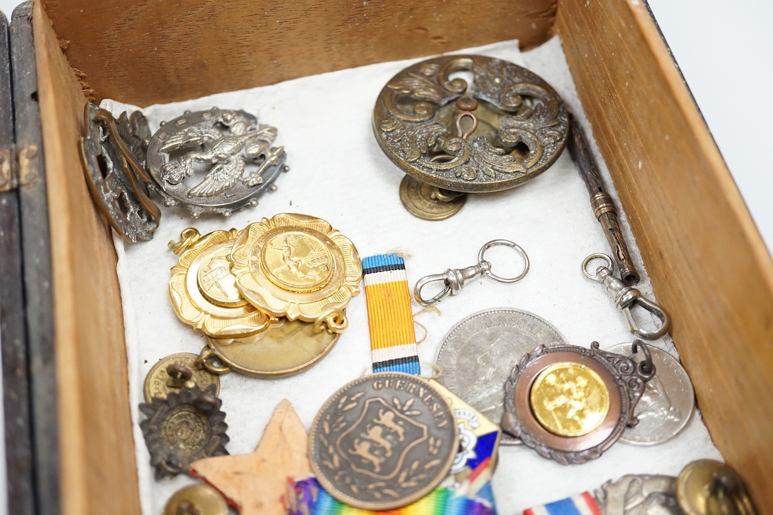 A quantity of assorted medals, an Essex crystal button, badges and ephemera